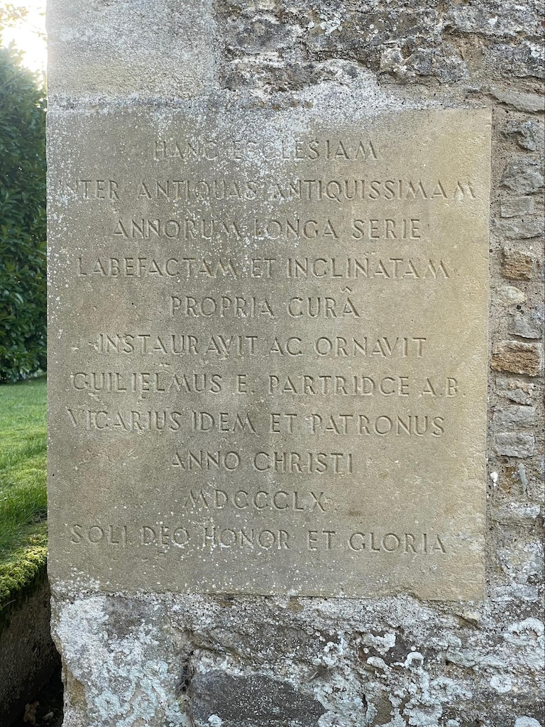 Stone tablet set in side of Church