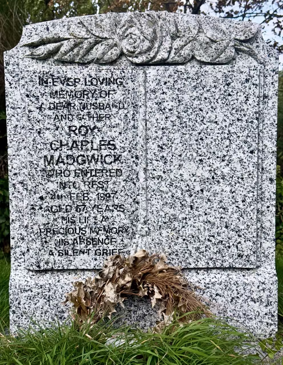 Headstone with rose carved top