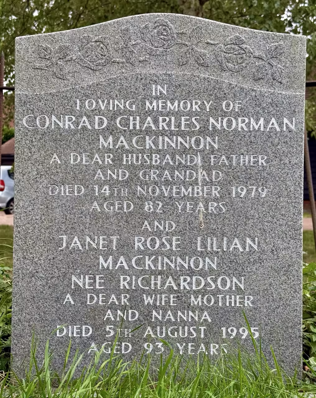 Headstone & metal plaque by tree (replaced)